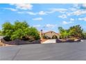Lovely home featuring mature trees, well-maintained landscaping, and a covered driveway at 9385 Mohawk St, Las Vegas, NV 89139