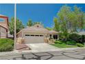 Charming single-story home with a well-manicured front yard and a two-car garage in a quiet neighborhood at 10198 Timber Willow Ave, Las Vegas, NV 89135