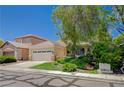 Charming single-story home with a well-manicured front yard and a two-car garage in a quiet neighborhood at 10198 Timber Willow Ave, Las Vegas, NV 89135