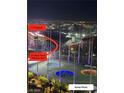 Night view of Topgolf with F1 Paddock and Racetrack (Harmon Ave) in the background, showing the city lights at 135 E Harmon Ave # 2116, Las Vegas, NV 89109