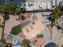 Drone shot of a large backyard featuring desert landscaping and artifical grass at 2821 Moon Cir, Las Vegas, NV 89120
