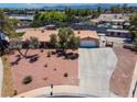Charming single-story home featuring a large driveway, xeriscape landscaping, and an inviting exterior design at 2821 Moon Cir, Las Vegas, NV 89120