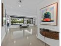 Bright foyer with modern decor, unique console table, and views of the backyard at 324 Park Way East, Las Vegas, NV 89106