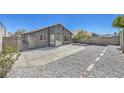 Spacious backyard with a concrete patio, gravel landscaping, and potential for outdoor living at 6456 First View Ave, Las Vegas, NV 89142