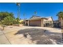 Exterior shot of house featuring desert landscaping, and an attached garage at 6616 Celeste Ave, Las Vegas, NV 89107