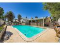 Refreshing in-ground pool with a spacious deck and covered patio area at 6616 Celeste Ave, Las Vegas, NV 89107