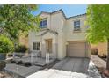 Charming two-story home featuring a covered front porch and a one-car garage at 7640 Woven Memories St, Las Vegas, NV 89149