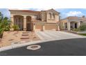 Stunning two-story home featuring a three-car garage, inviting entrance, and manicured front yard at 8605 Trianon Ln, Las Vegas, NV 89145