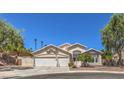 Charming two-story home with a three-car garage and manicured landscaping at 1145 Glacier Park Ct, Henderson, NV 89052