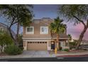 Charming two-story home with a well-maintained lawn, desert landscaping, and attached two-car garage at 1246 Diamond Valley St, Henderson, NV 89052