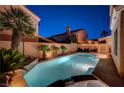 Inviting backyard pool with lush landscaping, perfect for relaxation and outdoor enjoyment at 1968 Evening Glow Dr, Las Vegas, NV 89134