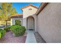 Close up of home's front entrance with desert landscaping and stone accents at 2150 Maple Heights Ct, Henderson, NV 89052