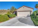 Charming single-story home with a two-car garage and well-manicured landscaping at 2150 Maple Heights Ct, Henderson, NV 89052