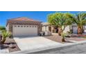 Inviting single-story home with stone accents, desert landscaping, and a convenient two-car garage at 2508 Chasma Dr, Henderson, NV 89044