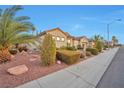 Attractive single-story home with desert landscaping and a tile roof at 2585 Portsmouth Creek Ave, Henderson, NV 89052