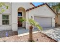 Charming single-story home featuring a two-car garage and desert landscaping at 3609 Blue Pimpernel Ave, North Las Vegas, NV 89081