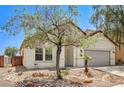 Charming single-story home featuring a two-car garage and desert landscaping at 3609 Blue Pimpernel Ave, North Las Vegas, NV 89081