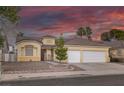 Charming single-story home featuring a desert-landscaped yard, and a spacious two-car garage at 5512 Goldbrush St, Las Vegas, NV 89130