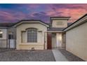 Inviting front entrance featuring desert-style landscaping and a secure gated doorway at 5512 Goldbrush St, Las Vegas, NV 89130