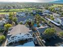 An aerial view of the condo community including a pool, covered parking, lush landscaping, and well-maintained buildings at 5655 E Sahara Ave # 1053, Las Vegas, NV 89142