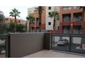 This patio area provides a semi-private outdoor space with views of the complex and its landscaping at 63 E Agate Ave # 202, Las Vegas, NV 89123