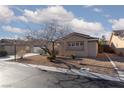 Attractive single-story home boasts a neatly landscaped front yard and inviting curb appeal at 8213 Cabin Springs Ave, Las Vegas, NV 89131