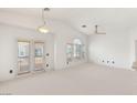 Bright, spacious living room with large windows and neutral tones at 89 Day Trade St # 1, Henderson, NV 89074