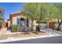 Attractive home featuring mature trees, manicured landscaping, and a convenient two-car garage at 9864 Maspalomas St, Las Vegas, NV 89178