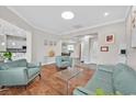 Bright living room with hardwood floors, stylish furniture, and an open floor plan at 10325 Sweet Fennel Dr, Las Vegas, NV 89135