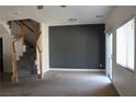 Spacious room featuring a staircase and a sliding glass door to the backyard at 1081 Elation Ln # 2, Henderson, NV 89002