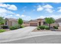 A charming house with a well-manicured lawn and lengthy drive-way provides great curb appeal at 11139 Zarod Rd, Las Vegas, NV 89135