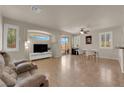 Bright living room with tile floors, neutral walls, and views to the outside patio and backyard at 11139 Zarod Rd, Las Vegas, NV 89135