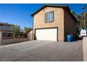 The home offers a spacious two-car garage and a well-kept exterior, providing ample parking and enhancing its overall appeal at 1340 Lucky St, Las Vegas, NV 89104