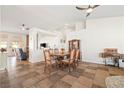 Spacious dining area features stylish tiling, an open floor plan, and natural light from the backyard at 159 Coastal Pier Ct, Henderson, NV 89002