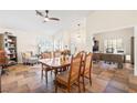 Bright open-concept living and dining area, with stylish decor, and a connected office space at 159 Coastal Pier Ct, Henderson, NV 89002