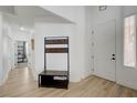 Spacious home entryway with coat rack and hardwood floors at 201 Crown Imperial St, Henderson, NV 89074