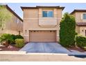 Two-story home featuring a two-car garage and desert landscaping at 248 Crystal Rose Ct, Las Vegas, NV 89106