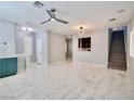 Open living area with marble floors and staircase at 248 Crystal Rose Ct, Las Vegas, NV 89106