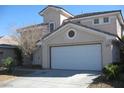 Charming two-story home featuring a two-car garage and a well-maintained front yard at 254 Horizon Pointe Cir, Henderson, NV 89012