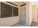 Inviting front entry featuring a security door and adjacent windows for ample natural light at 3337 Partridge Run St, Laughlin, NV 89029