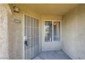 Welcoming front entrance of a condo with security gate and window, providing both security and natural light at 4400 S Jones Blvd # 2007, Las Vegas, NV 89103