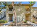 Inviting condo exterior featuring well-kept landscaping and multiple units, creating a sense of community at 4400 S Jones Blvd # 2007, Las Vegas, NV 89103