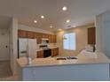 Clean kitchen with updated appliances, ample cabinet space, and a bright, open layout at 4814 Regalo Bello St, Las Vegas, NV 89135