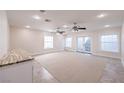 Bright living room featuring fresh carpet, neutral paint, recessed lighting and outdoor access at 5110 N Valadez St, Las Vegas, NV 89149