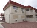 Apartment exterior with multiple windows, access stairs and balcony with neutral paint at 5388 Swenson St # 26, Las Vegas, NV 89119