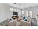 Cozy living room with hardwood floors, modern furniture and plenty of light at 6346 Azurelyn Ave, Las Vegas, NV 89122