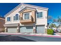 Charming townhome featuring a private balcony and three-car garage at 6610 Tumbleweed Ridge Ln # 101, Henderson, NV 89011
