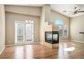 Bright living room with a fireplace and wood flooring at 6610 Tumbleweed Ridge Ln # 101, Henderson, NV 89011