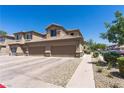 Attached two-car garage with ample driveway space, set within a well-kept community at 6635 Caporetto Ln # 204, North Las Vegas, NV 89084