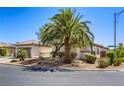 Landscaped front view of single-story home featuring desert landscaping, tile roof, and two-car garage at 7286 Mount Kearsarge St, Las Vegas, NV 89131